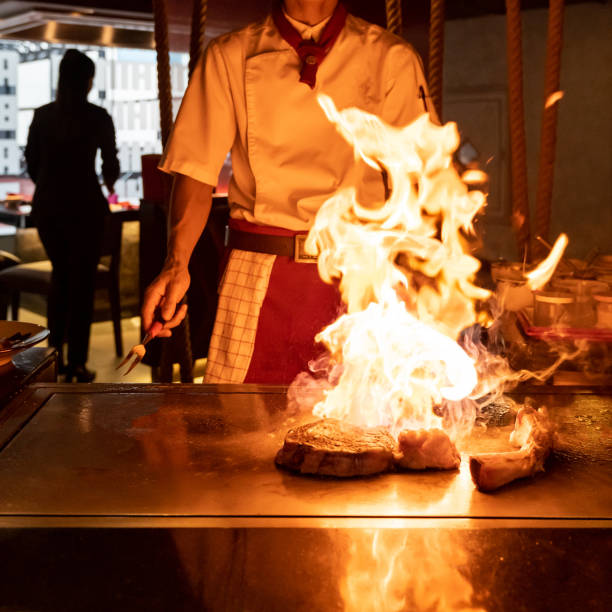 Professional Hibachi Chef with Dramatic Fire Performance